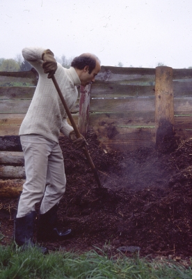 Turning compost pile.