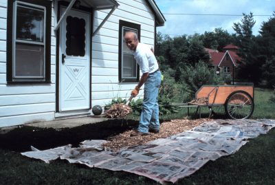 spreading wood chips in path