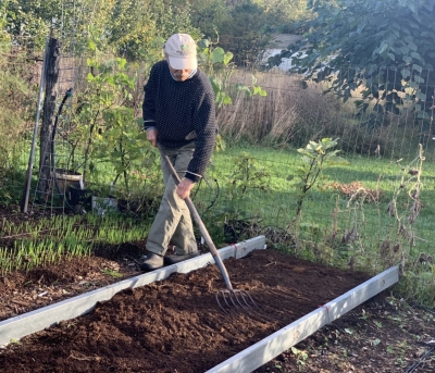 Patting down compost
