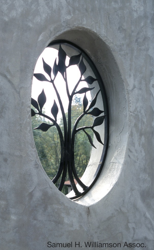 Elliptical window in garden wall