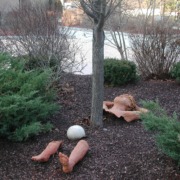 Mulched tree with ground sculpture