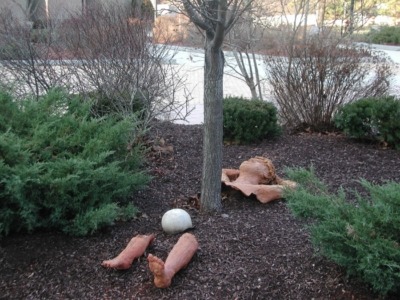 Mulched tree with sculpture